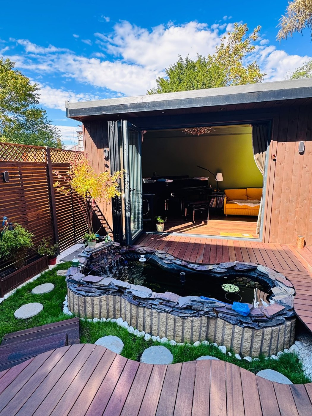 Wider finished view of the garden pond and deck