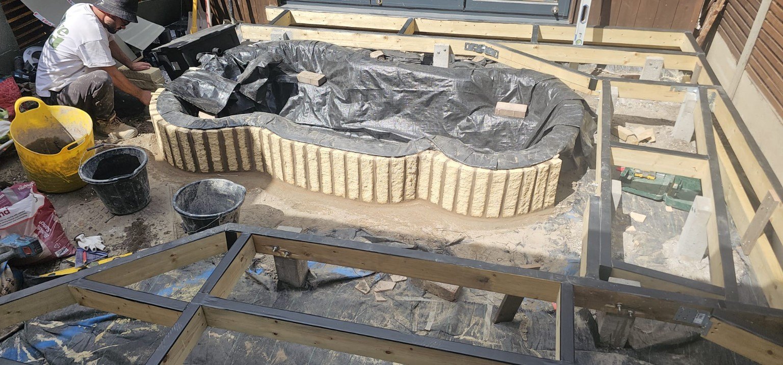 Pond and timber frame during construction